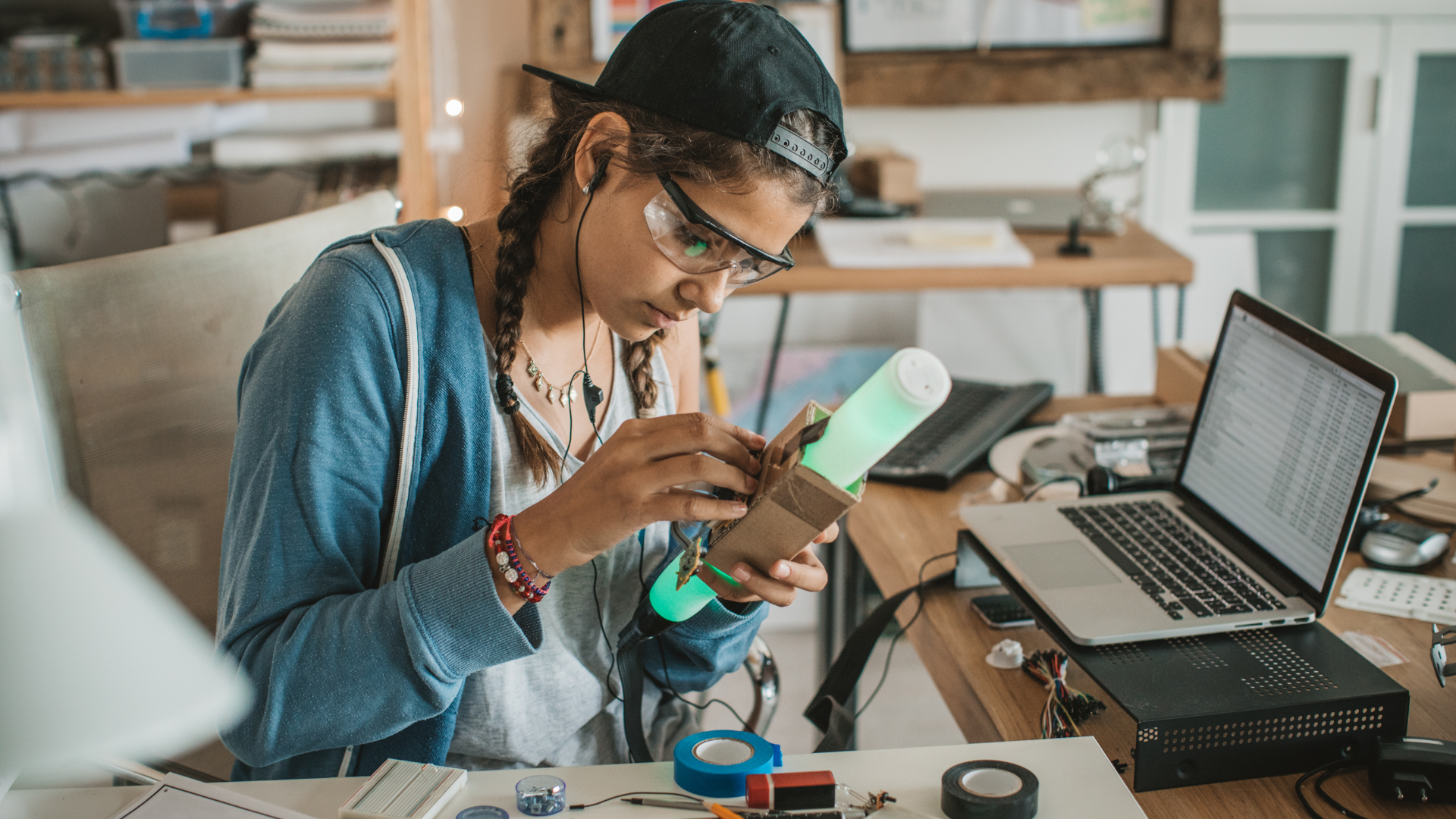 Image of teenager working on a engineering project at home