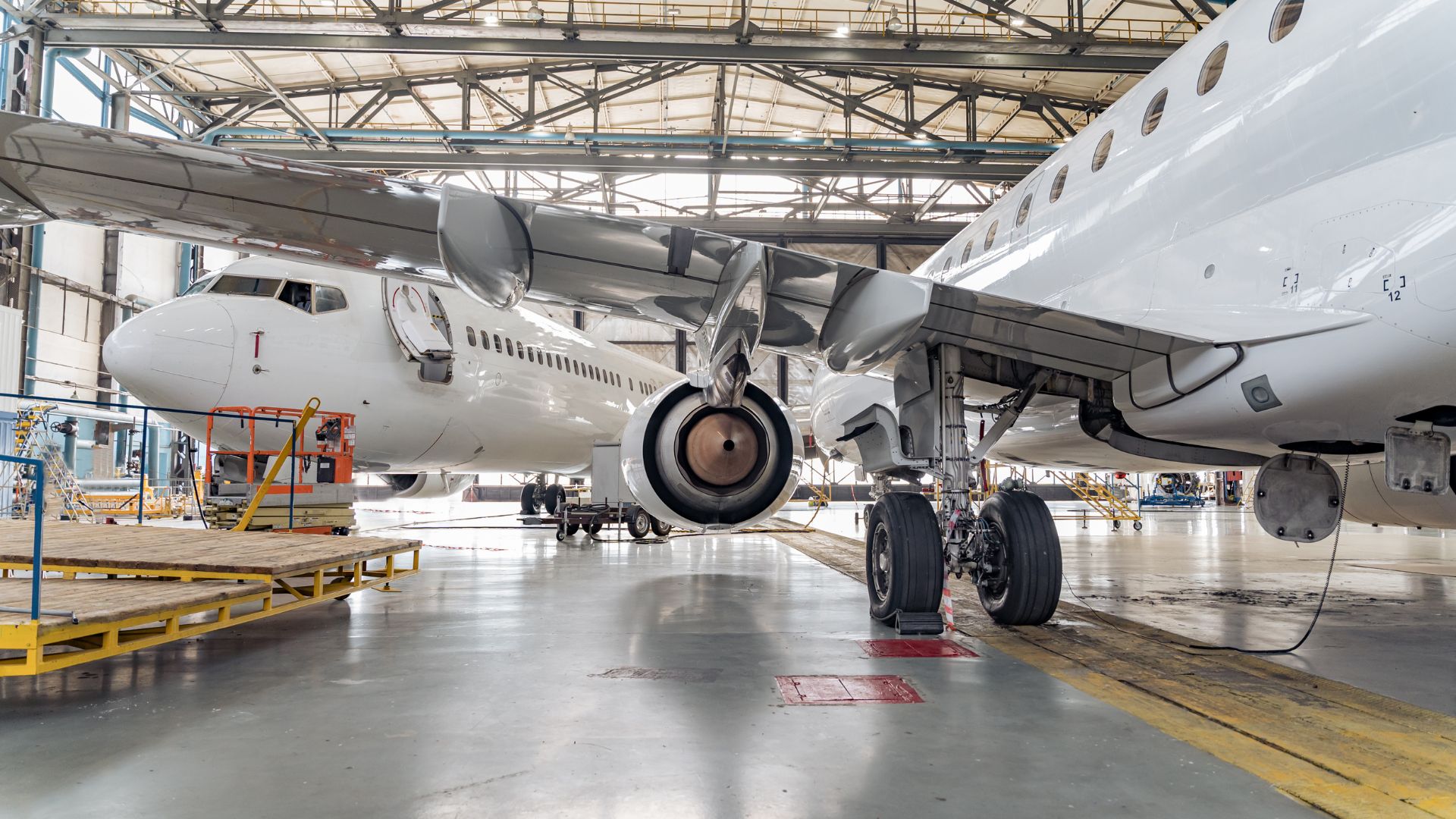 Image of two planes in a hangar