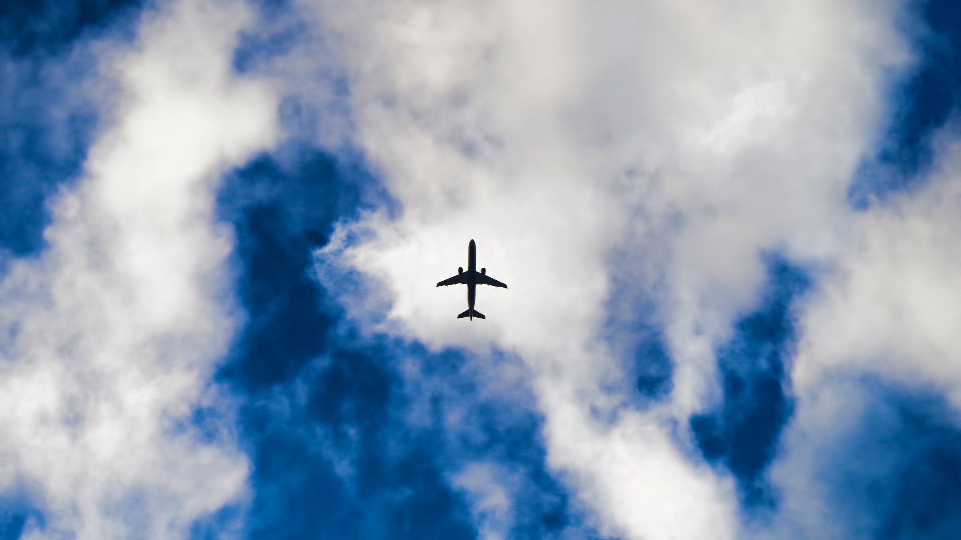 Image of plane in cloudy sky