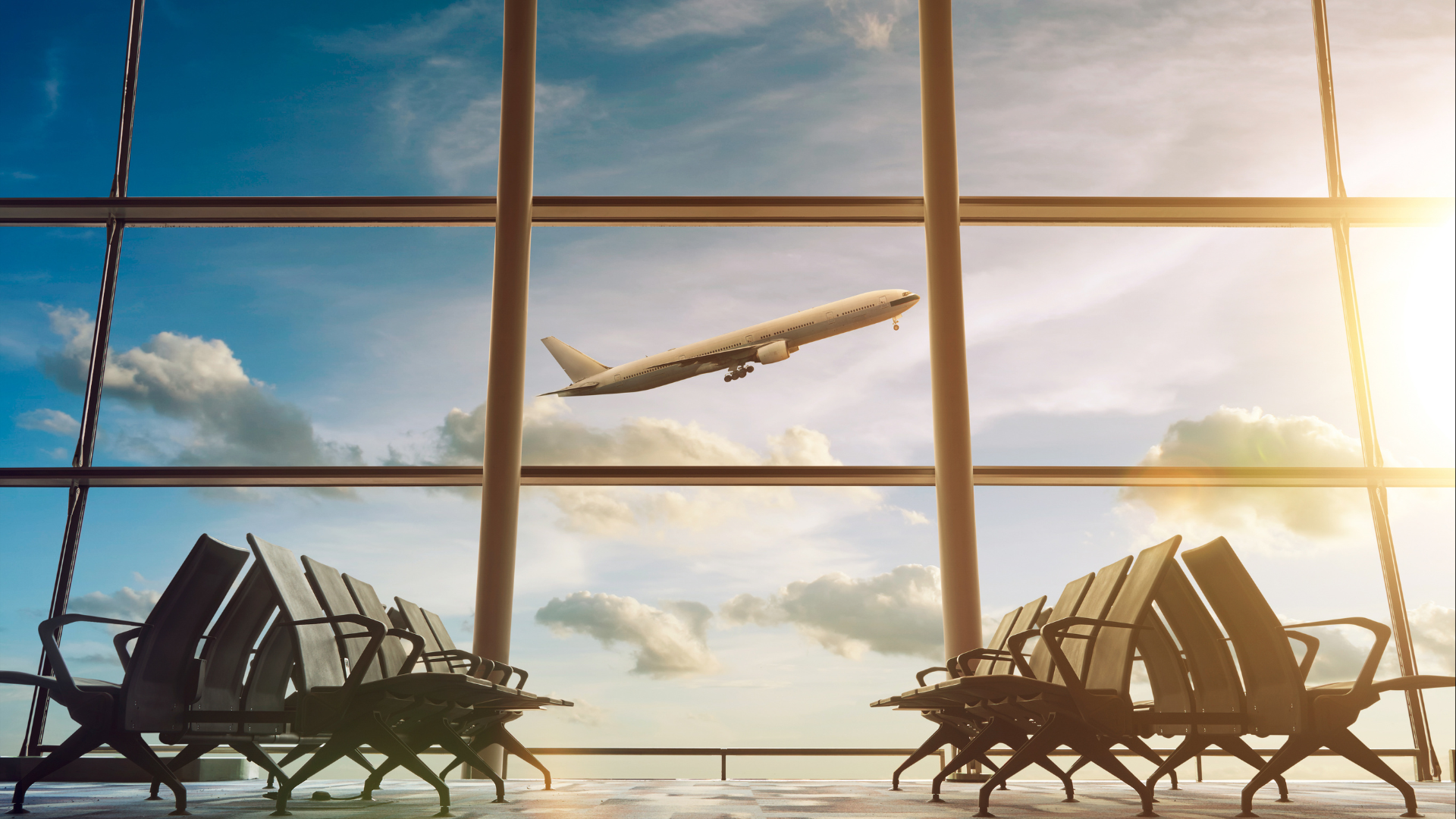 Airport Terminal With Plane Taking Of In Window